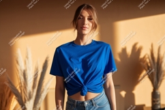 Woman wearing blue t shirt and jeans Product Image 1