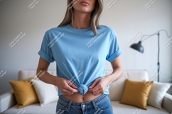Woman wearing blue t shirt tied at waist image Product Image 1