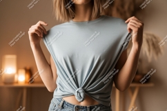 Woman wearing light blue t shirt tied at waist image Product Image 1