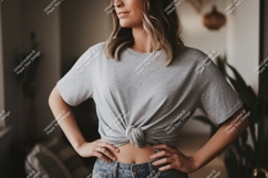 Woman wearing grey t shirt tied at waist t-shirt knot Product Image 1