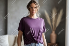 Woman wearing purple t shirt and jeans image Product Image 1
