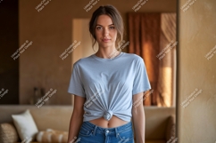 Woman wearing light blue t shirt and denim jeans image Product Image 1