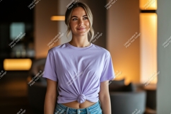 Woman wearing lavender t shirt and denim jeans image Product Image 1
