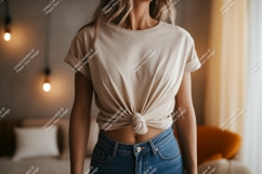 Woman wearing beige t shirt and denim jeans image Product Image 1