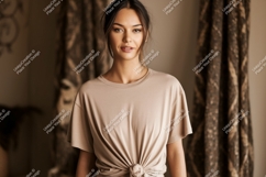 Woman wearing knotted beige t-shirt Product Image 1
