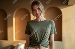 Woman wearing olive green t-shirt tied at waist Product Image 1