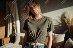 Woman wearing olive green t shirt and denim image Product Image 1
