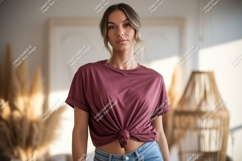 Woman wearing maroon t shirt and denim jeans image Product Image 1