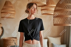 Woman wearing black t shirt and beige pants image Product Image 1
