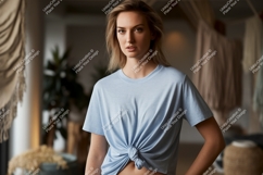 Woman wearing light blue t shirt tied at waist image Product Image 1