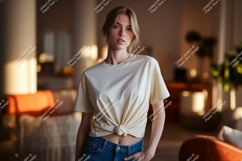 Woman wearing cream t shirt tied at waist Product Image 1