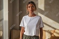 Woman wearing white t-shirt and green pants Product Image 1