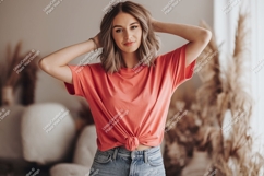 Woman wearing coral t shirt and denim jeans t-shirt Product Image 1
