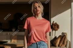 Woman wearing coral t shirt and denim image Product Image 1