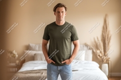 Man wearing olive green t shirt and jeans Product Image 1