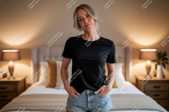 Woman wearing black t-shirt and denim shorts Product Image 1