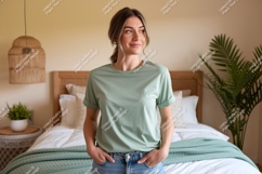Woman wearing green t-shirt and jeans bedroom Product Image 1