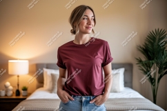 Woman wearing maroon t shirt and jeans image Product Image 1