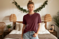 Woman wearing maroon t shirt and denim shorts image Product Image 1