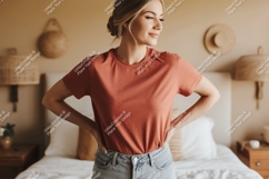Woman wearing terracotta t shirt and denim jeans Product Image 1