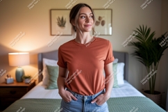 Woman wearing terracotta t shirt and denim shorts image Product Image 1
