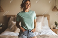 Young woman wearing mint t-shirt and denim shorts Product Image 1