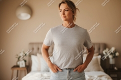 Woman wearing grey t shirt and denim jeans t-shirt Product Image 1