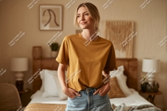 Woman wearing mustard t shirt and denim shorts image Product Image 1