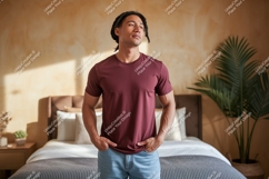 Man wearing maroon t shirt and blue jeans image Product Image 1