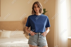 Woman wearing blue t shirt and denim shorts t-shirt Product Image 1