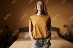 Woman wearing mustard t shirt and denim shorts image Product Image 1