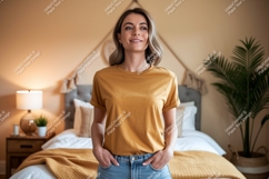 Woman wearing ochre t shirt in bedroom mockup Product Image 1