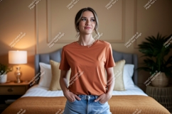 Woman wearing orange t shirt and jeans Product Image 1