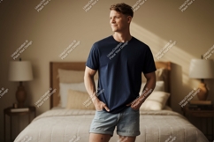Man wearing navy t-shirt and denim shorts Product Image 1