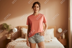 Woman wearing coral t shirt and denim shorts Product Image 1