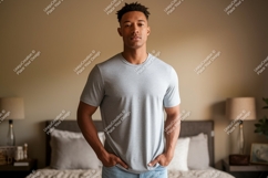 Man wearing grey t shirt and blue jeans t-shirt Product Image 1