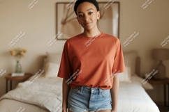 Woman wearing terracotta t shirt and denim shorts image Product Image 1
