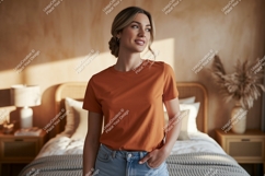 Woman wearing orange t shirt and jeans image Product Image 1