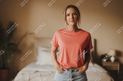 Woman wearing coral t shirt and denim shorts image Product Image 1