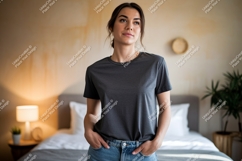 Woman wearing dark grey t shirt and blue jeans image Product Image 1