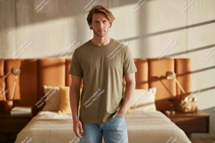 Man wearing olive green t shirt and denim jeans image Product Image 1
