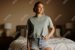 Woman wearing green t shirt and denim shorts image Product Image 1