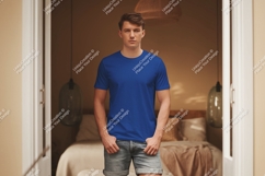 Man wearing blue t shirt and denim shorts t-shirt Product Image 1