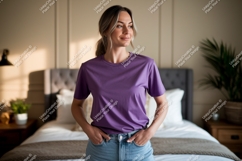 Woman wearing purple t shirt and jeans image Product Image 1