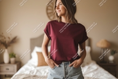 Woman wearing maroon t shirt and denim shorts Product Image 1