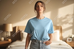 Woman wearing light blue t shirt and denim jeans image Product Image 1