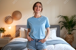 Woman wearing blue t shirt and denim shorts image Product Image 1