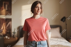 Woman wearing coral t shirt and denim jeans image Product Image 1