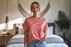 Woman wearing coral t shirt and jeans Product Image 1