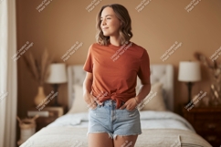Woman wearing terracotta t shirt and denim shorts image Product Image 1